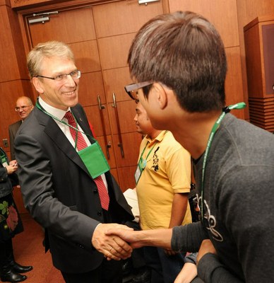 WCC general secretary Rev. Dr Olav Fykse Tveit greets a young participant at a pre-assembly gathering in Busan. Events leading up to WCC assembly focus on justice and peace
